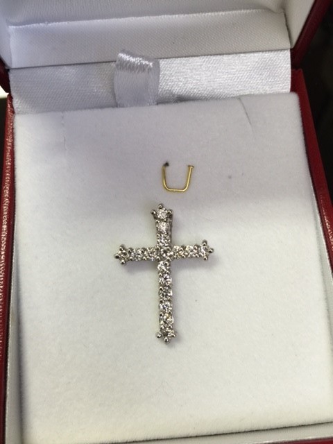 Elegant diamond pendant cross - $600